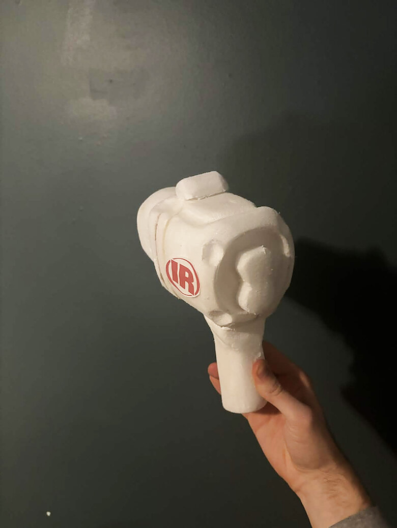 Foam model held in hand, three-quarter view